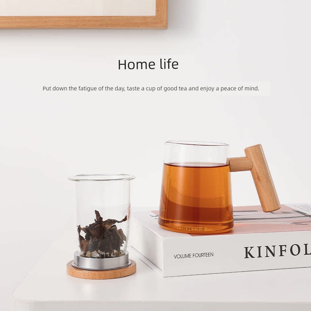 Elegant wooden and heat-resistant glass tea set with a built-in tea infuser for easy brewing and separation of tea leaves from water.